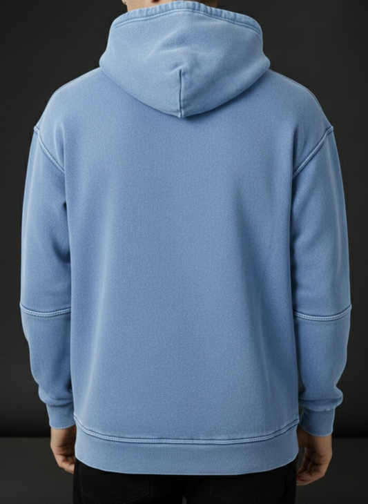 Light blue hoodie worn by a person on a black background