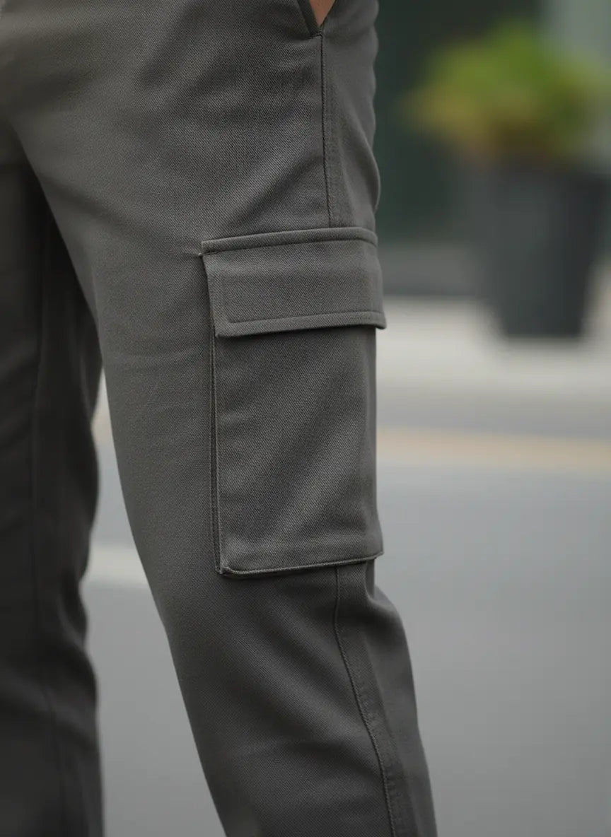 Close-up of gray cargo pants with a blurred background