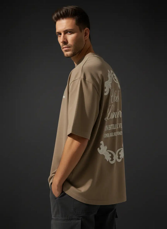 Man wearing a CLUB LUMIERE Oversized Cotton T-Shirt with white text and graphics on a dark background
