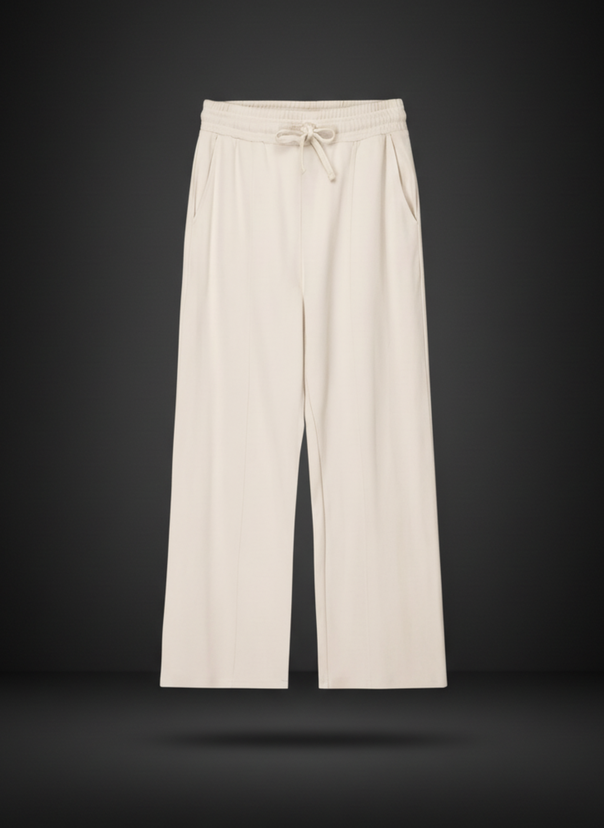Beige wide-leg pants with drawstring waist on a black background