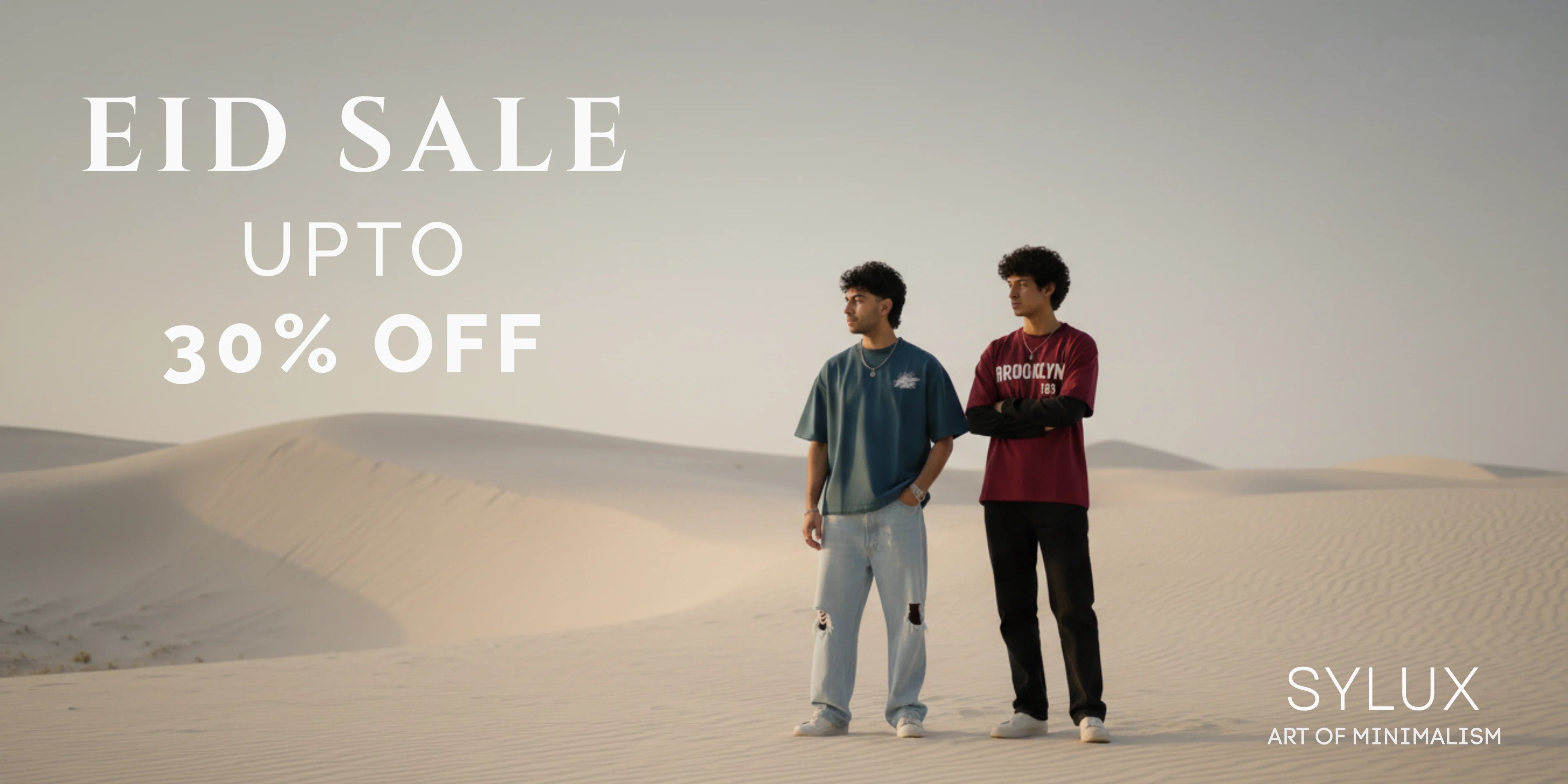 Two models standing in a desert with 'EID SALE UPTO 30% OFF' text and SYLUX branding.