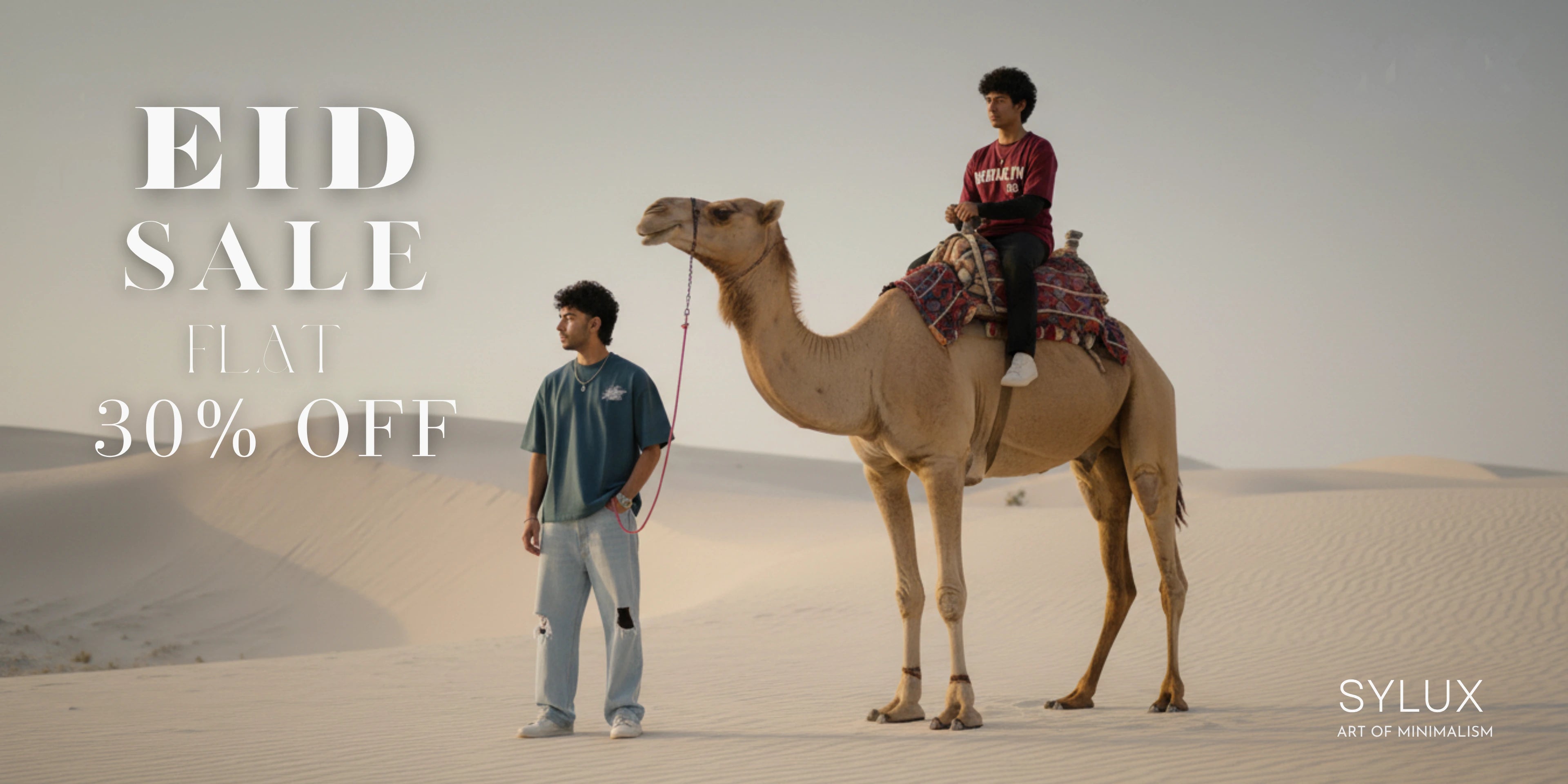 Person riding a camel in the desert with 'Eid Sale' text overlay and Sylux branding.