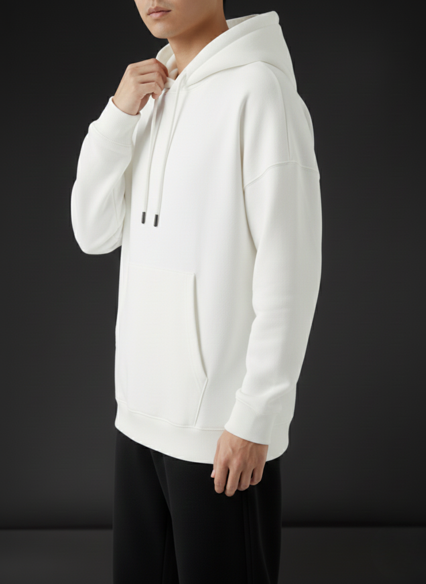 White hoodie worn by a person on a black background
