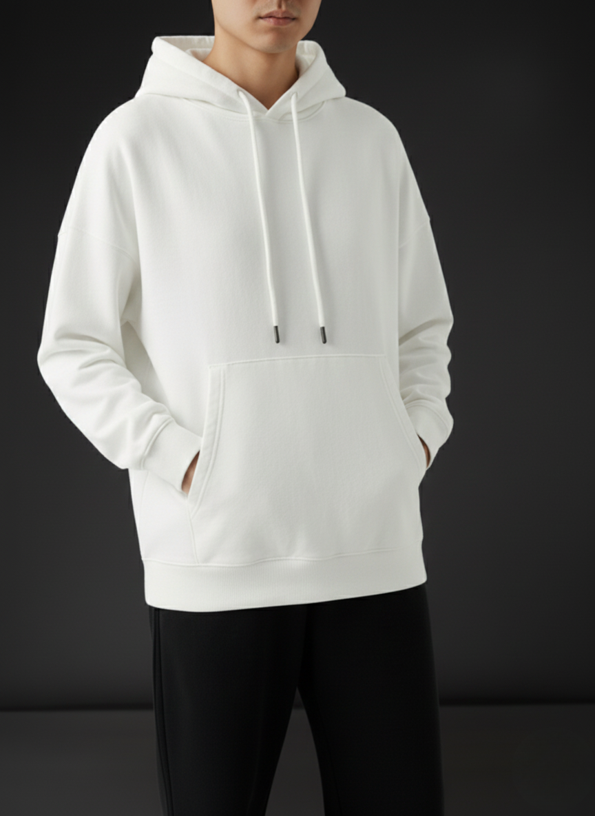 Person wearing a white hoodie on a black background