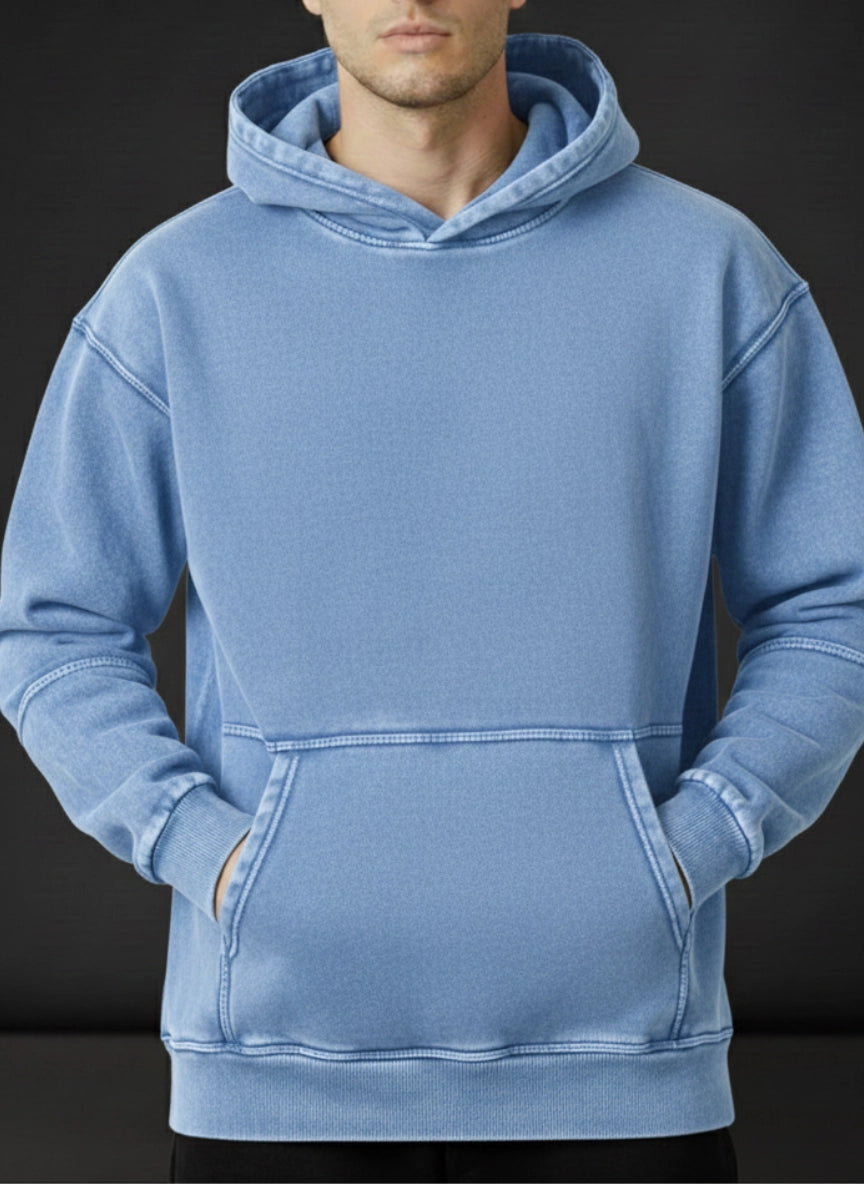 Blue hoodie worn by a person on a black background
