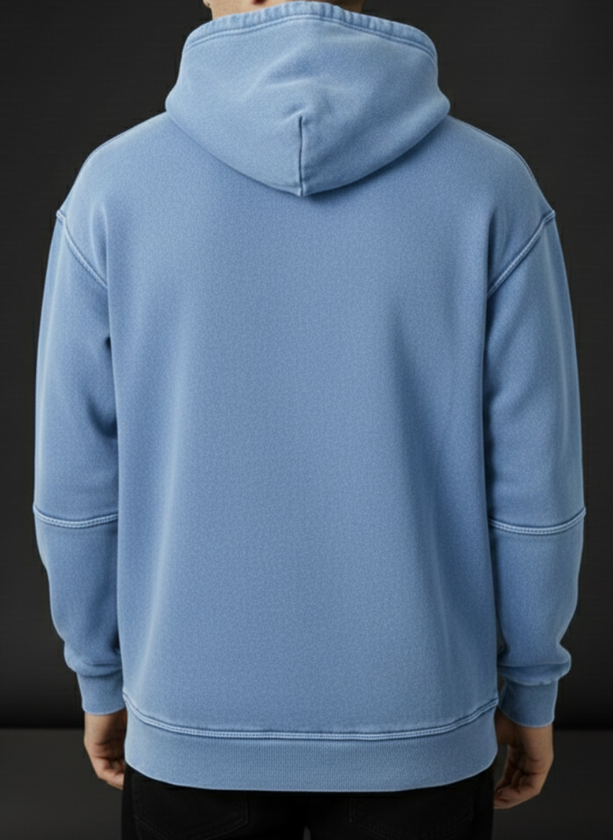 Light blue hoodie worn by a person on a black background