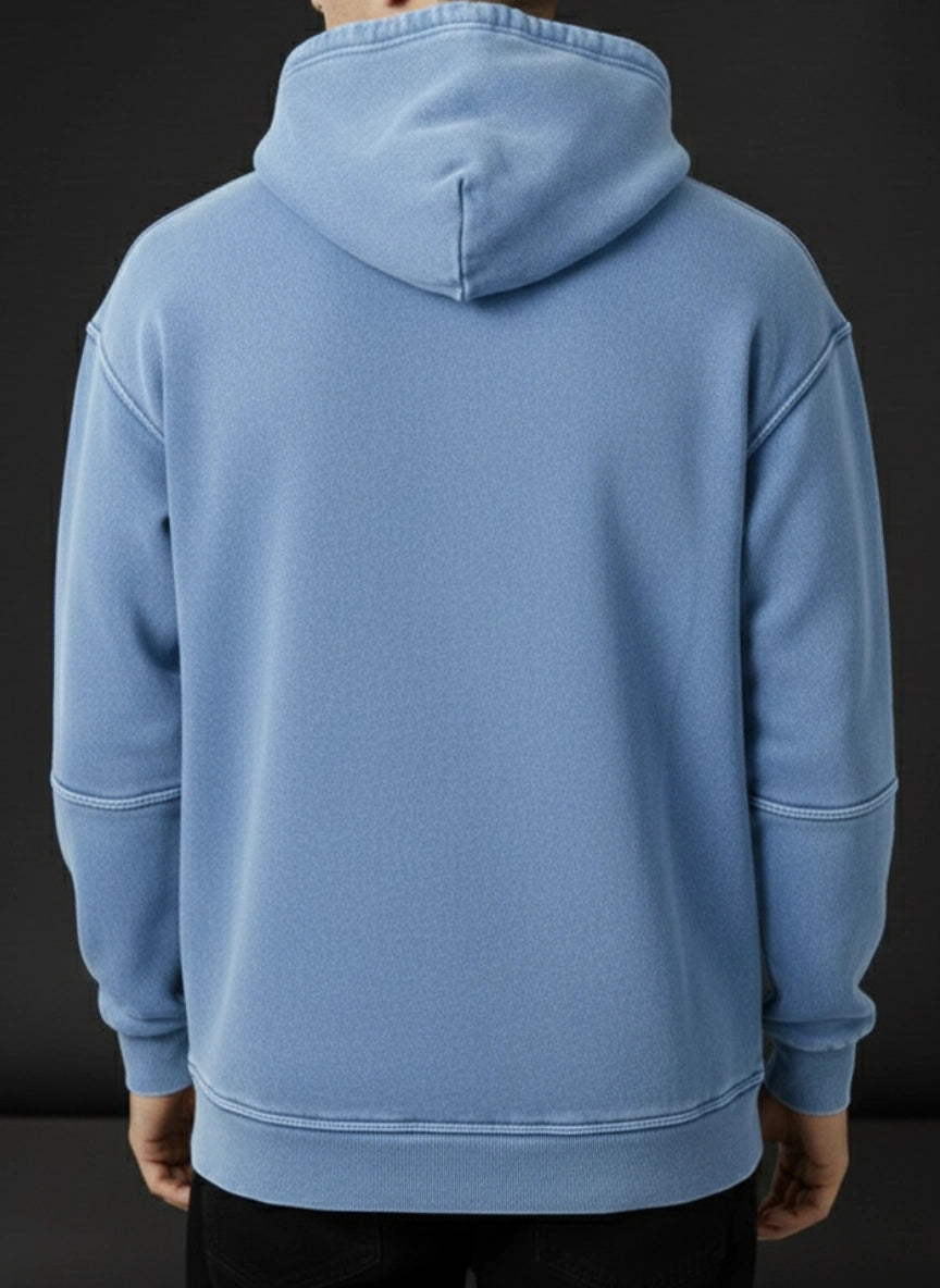 Light blue hoodie worn by a person on a black background