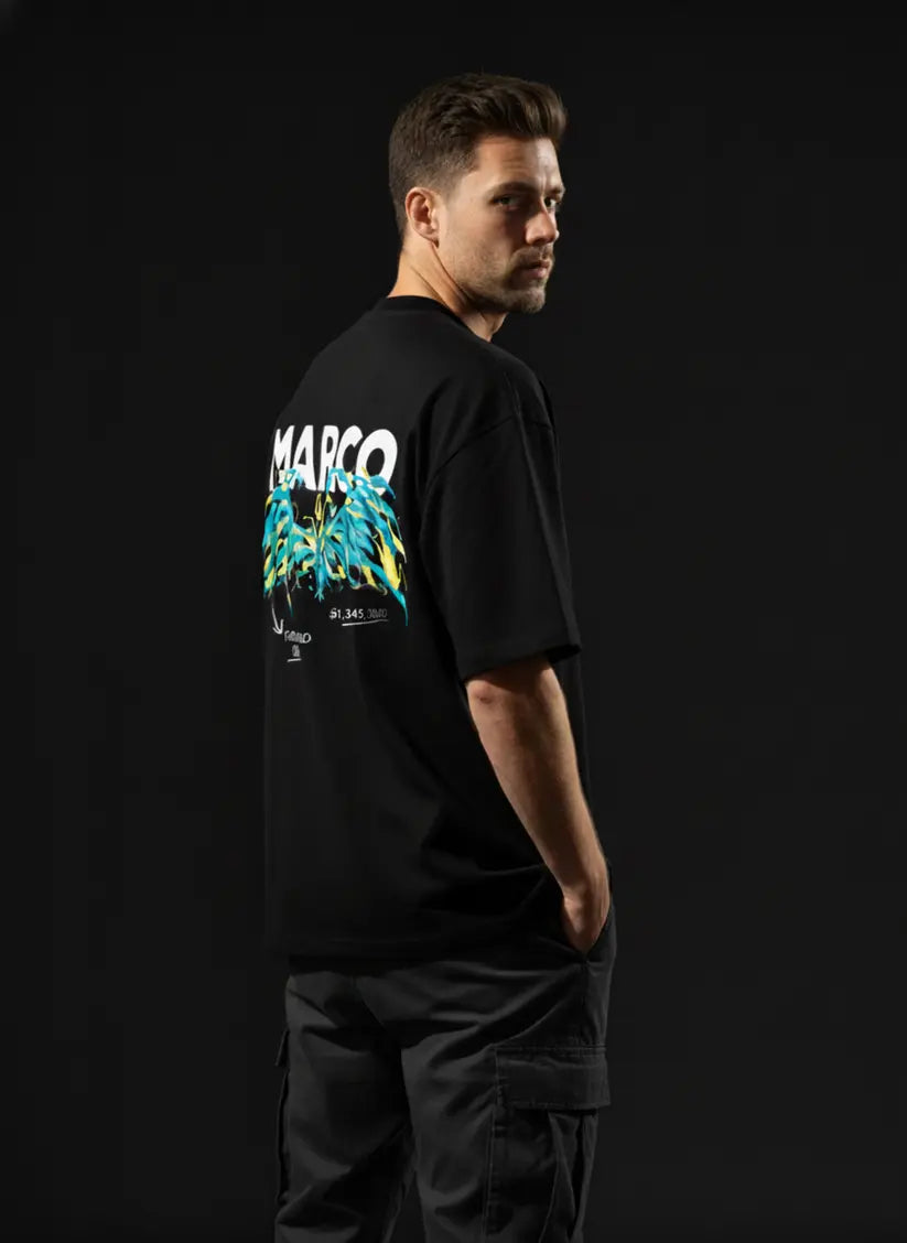 Person wearing a black t-shirt with 'Marco' design on the back against a dark background